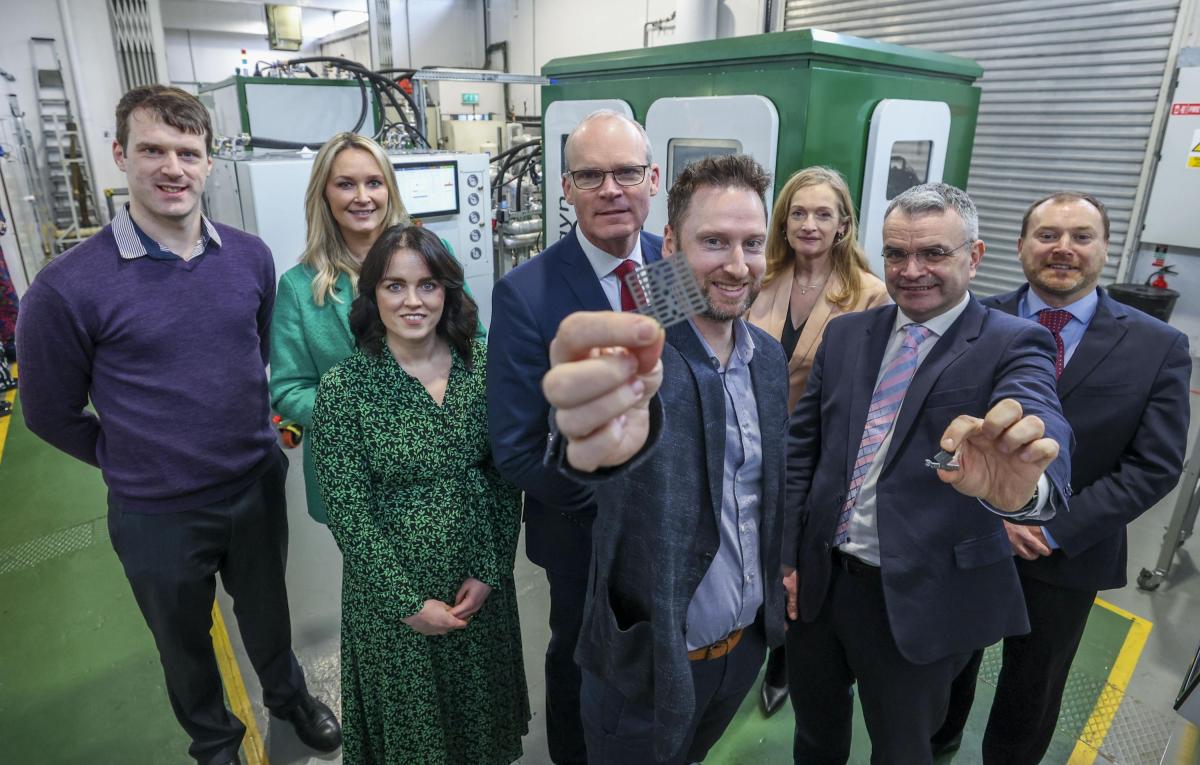Shows Simon Coveney with Exergyn staff